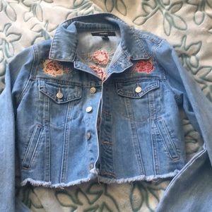 Blue denim jacket with roses on the back and front